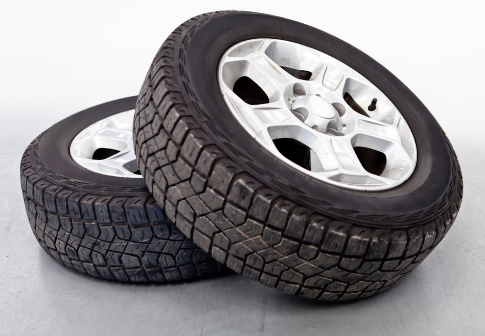 Car wheels or tires lying on the floor